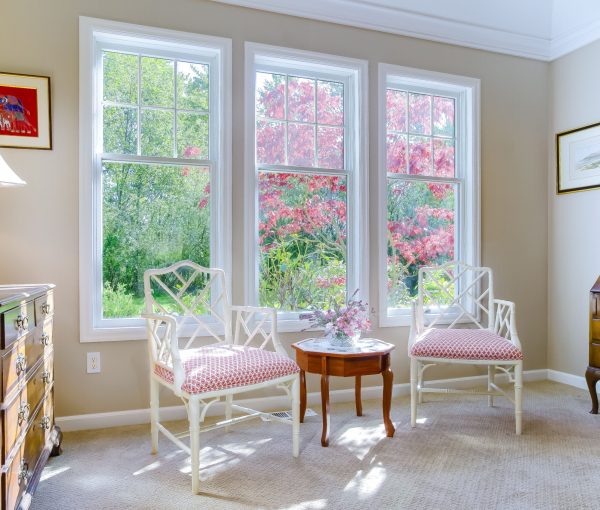 A quiet piano room designed for natural light, conversation, and the layered details that make a home feel personal.